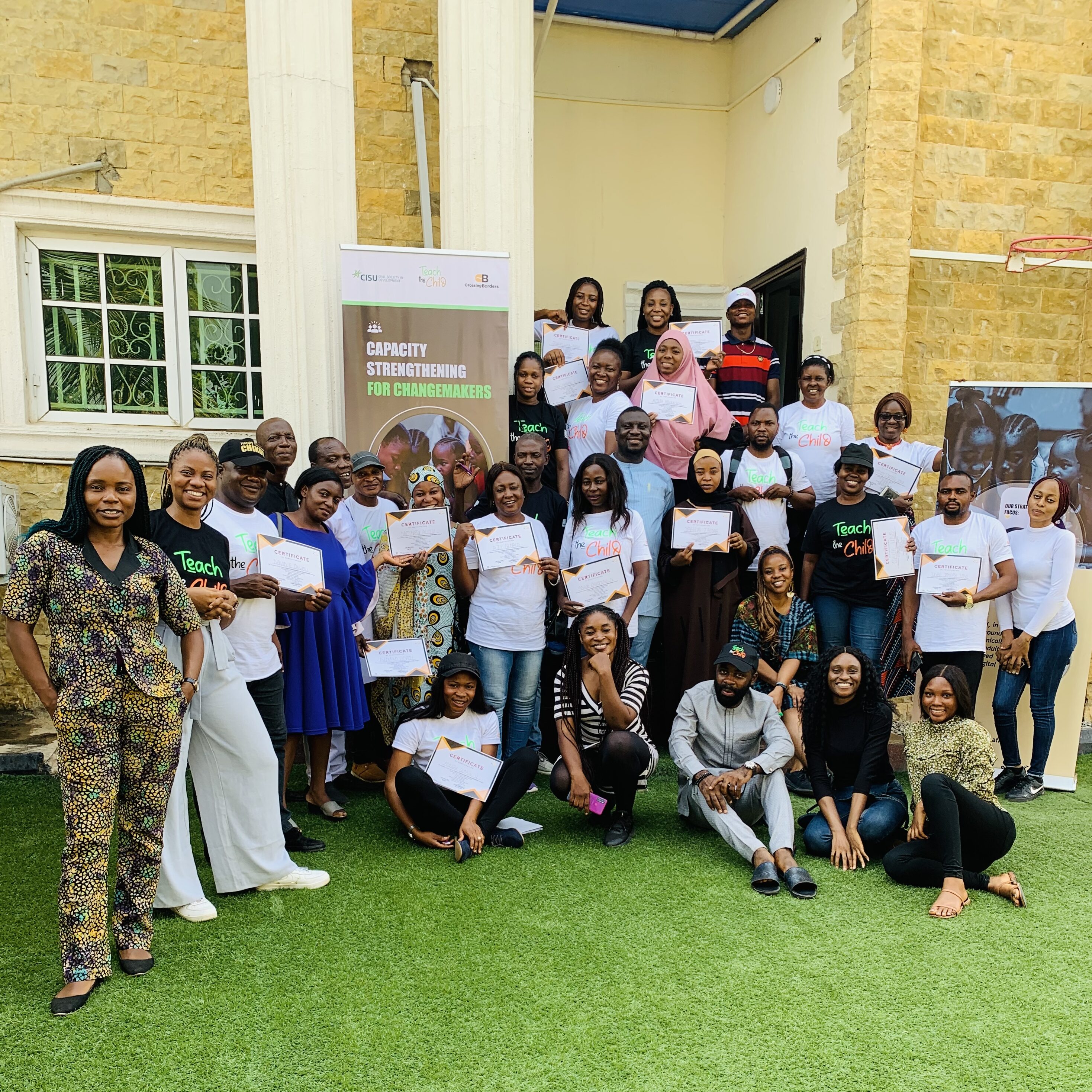 Educators and Facilitators pose together after receiving their certificates to mark completion of Capacity Strengthening For Changemakers, a program by Teach the Child