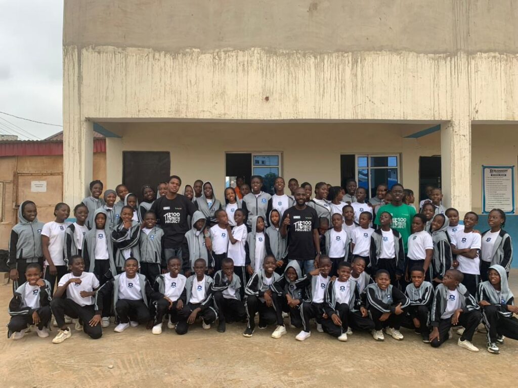 Students and volunteers from FCT Blossom Academy standing for pictures